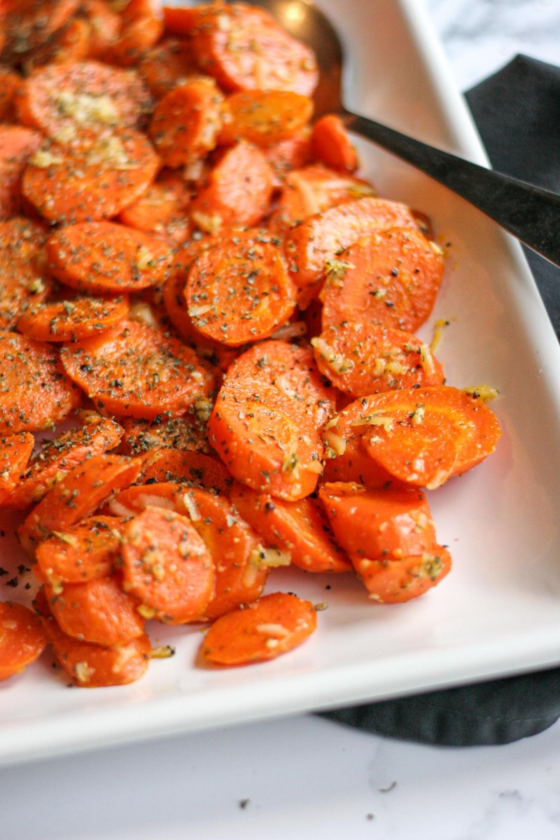 Roasted Carrots slices on a white tray.