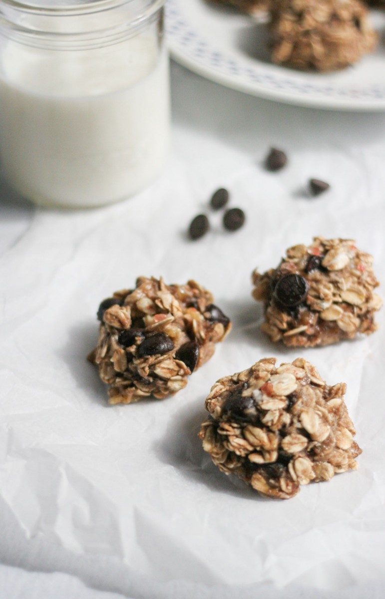 Healthy 3-Ingredient Sweet and Salty Oat Cookies on parchment paper with a glass of milk