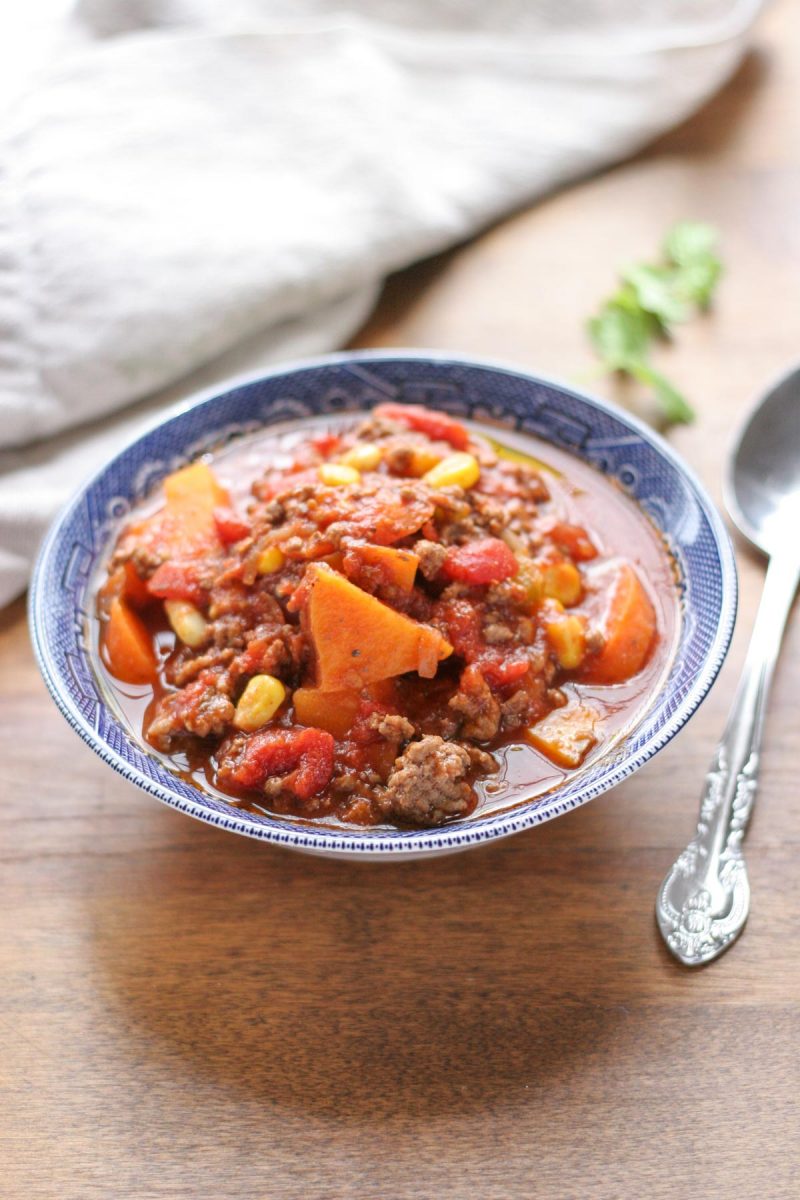 A blue bowl filled with Easy Weeknight Hamburger Soup with Sweet Potatoes