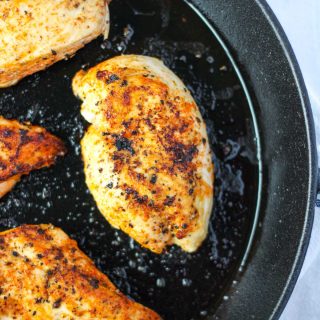 A chicken breast cooked in a Cast Iron Skillet