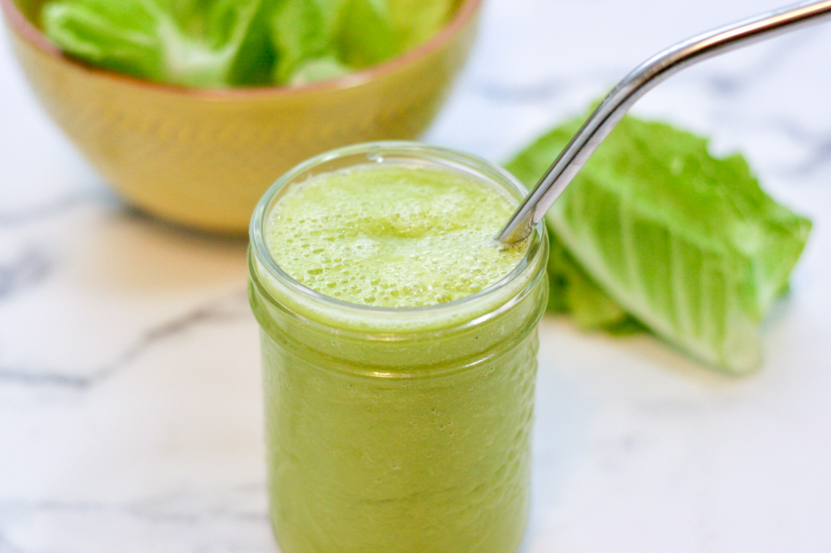 A small mason jar of 4 Ingredient Green Smoothie on a white countertop