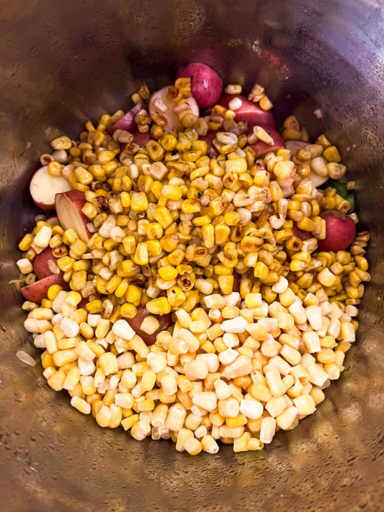 Add corn and potatoes to instant pot.