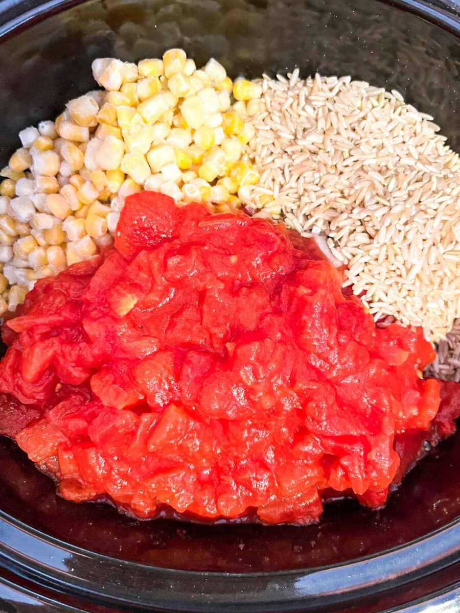 Add the rice, corn and tomatoes.
