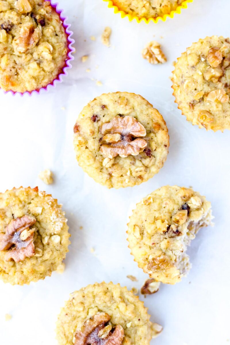 Banana oat muffins with walnuts on top.