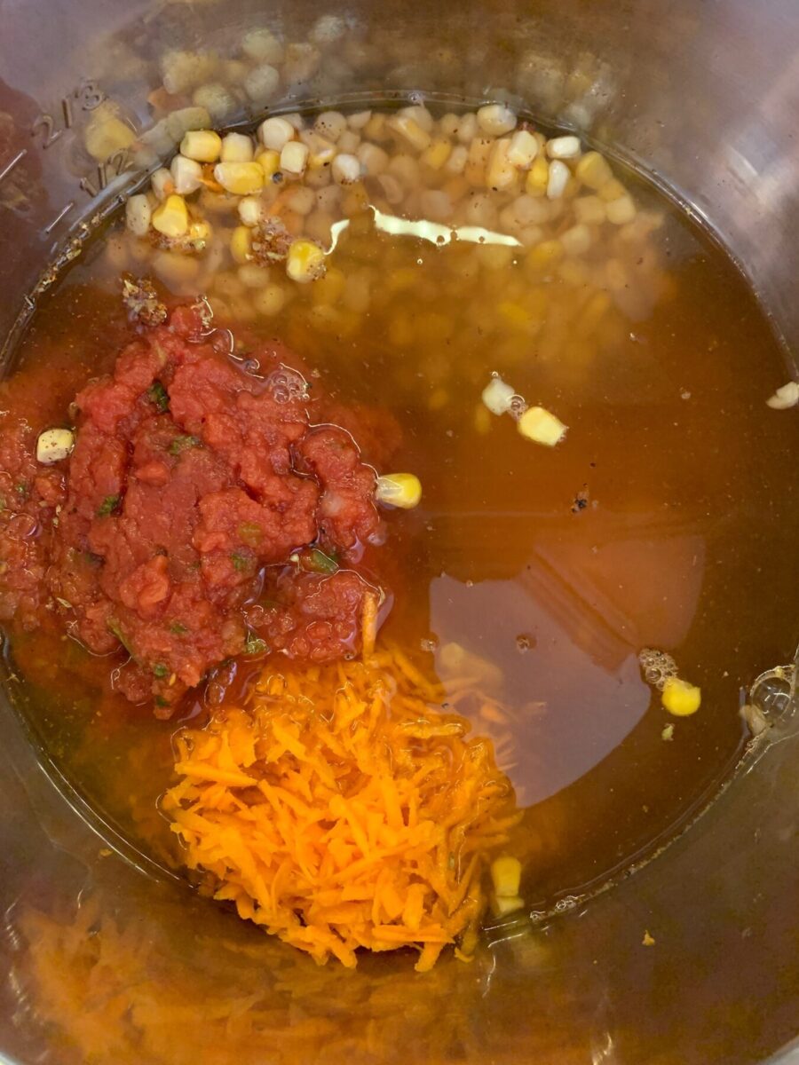 An Insta Pot with soup ingredients in it