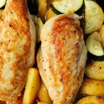 Baked Chicken with Zucchini and Peaches in a pan.