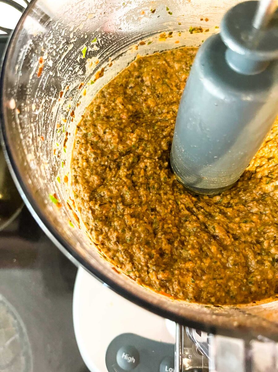 A food processor filled with black bean dip.