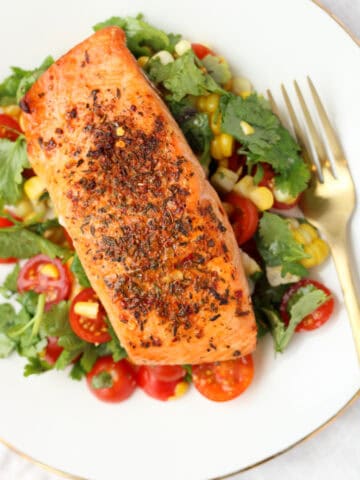Cajun Salmon with Simple Corn Salsa on a white plate.