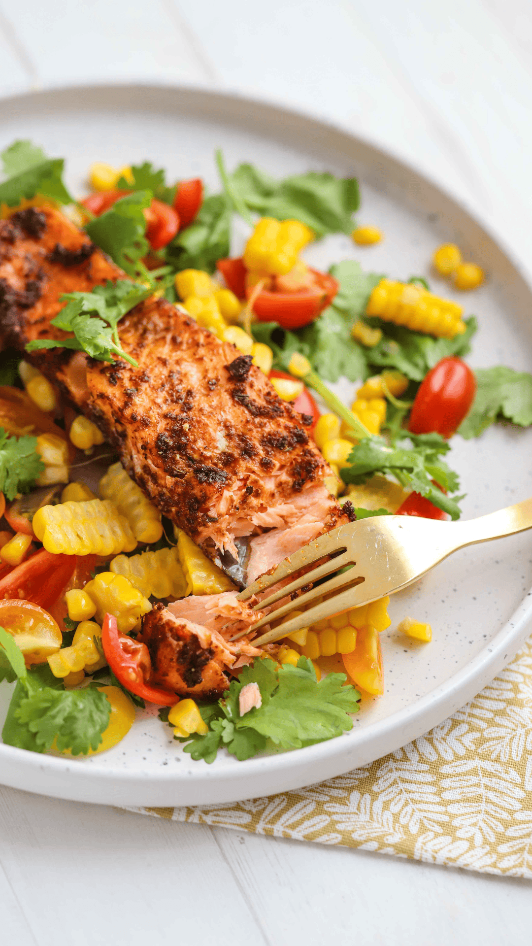 Cajun Salmon on a white plate with Corn Salsa.
