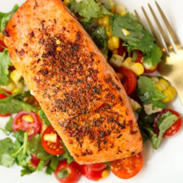 Cajun Salmon with Simple Corn Salsa on a white plate.
