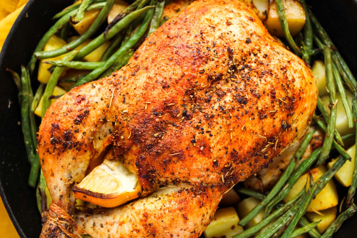 A roasted whole chicken with lemon.