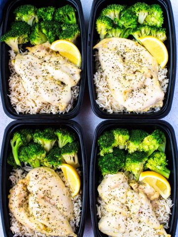 Four meal prep containers with chicken, rice and broccoli meal prep.