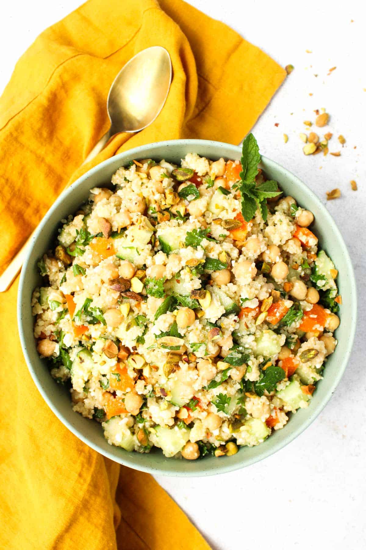 Bowl of quinoa salad with fresh vegetables.