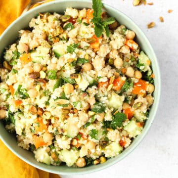 Bowl of quinoa salad with fresh vegetables.