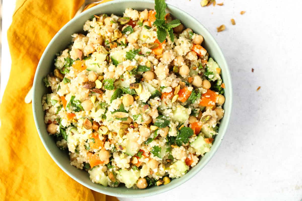 Bowl of quinoa salad with fresh vegetables.
