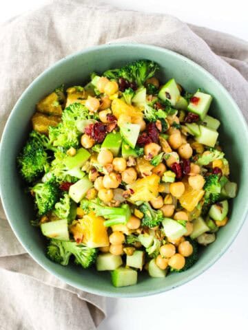 Healthy chopped Chickpea Salad with Oranges and Mint in a green bowl.