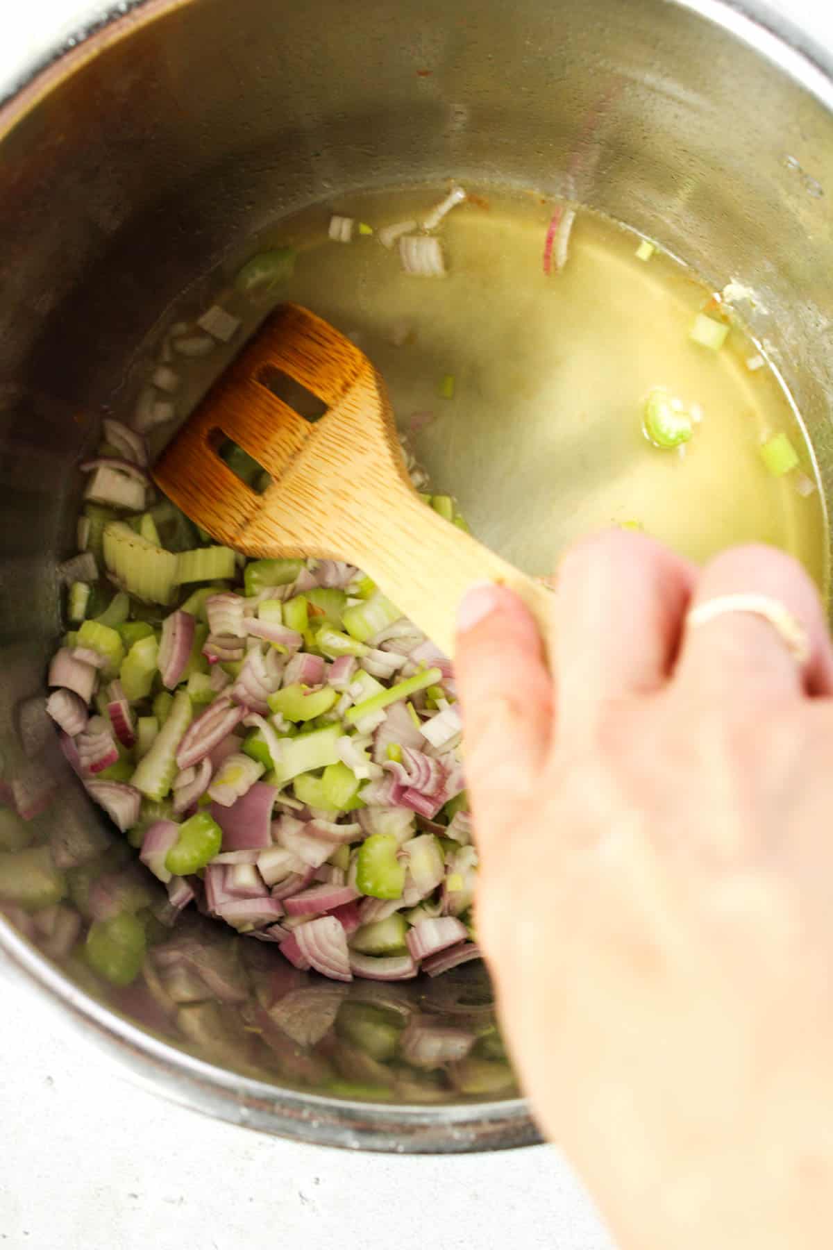 Cooking shallot and celery in an Instant Pot.