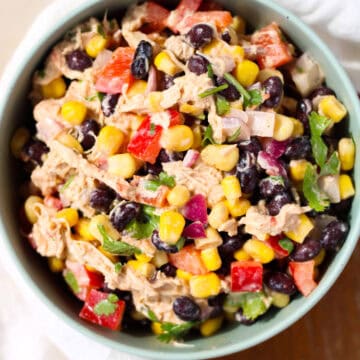 Creamy Chicken Black Bean and Corn Salad in a green bowl.