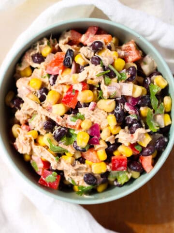 Creamy Chicken Black Bean and Corn Salad in a green bowl.