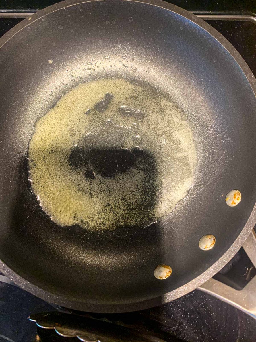 Melted butter in a small pan.
