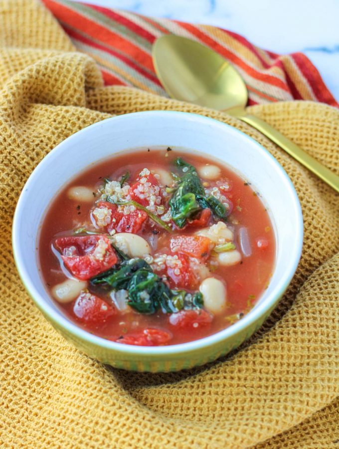 Easy Winter Soup with Beans in a white bowl with a gold spoon