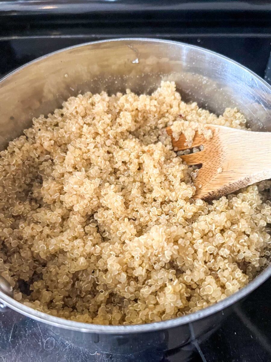 Cooked quinoa in a small pot.