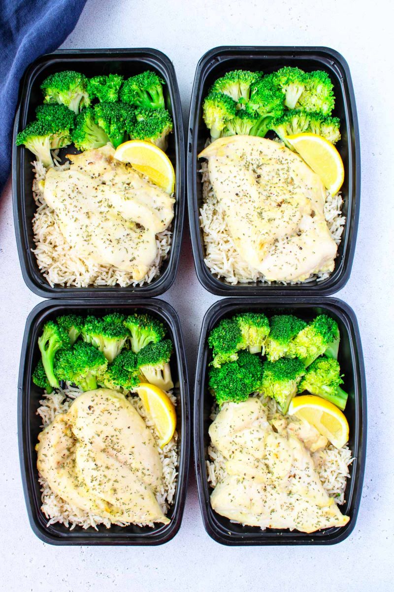 Four containers of chicken, rice and broccoli meal prep.
