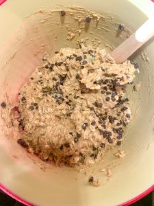 A mixing bowl filled with the batter for Gluten-Free Oatmeal Breakfast Bars with Chocolate