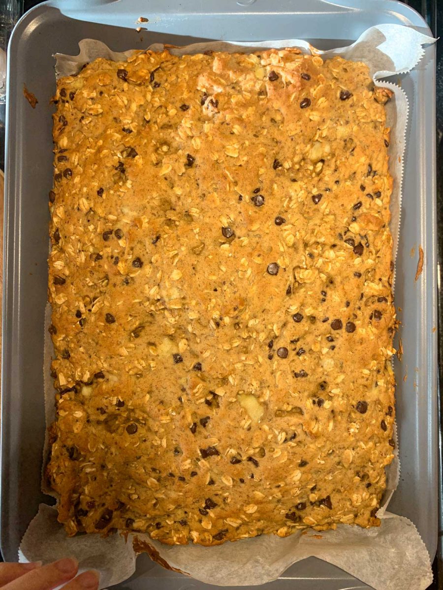 A large baking pan filled with Gluten-Free Oatmeal Breakfast Bars with Chocolate just out of the oven.