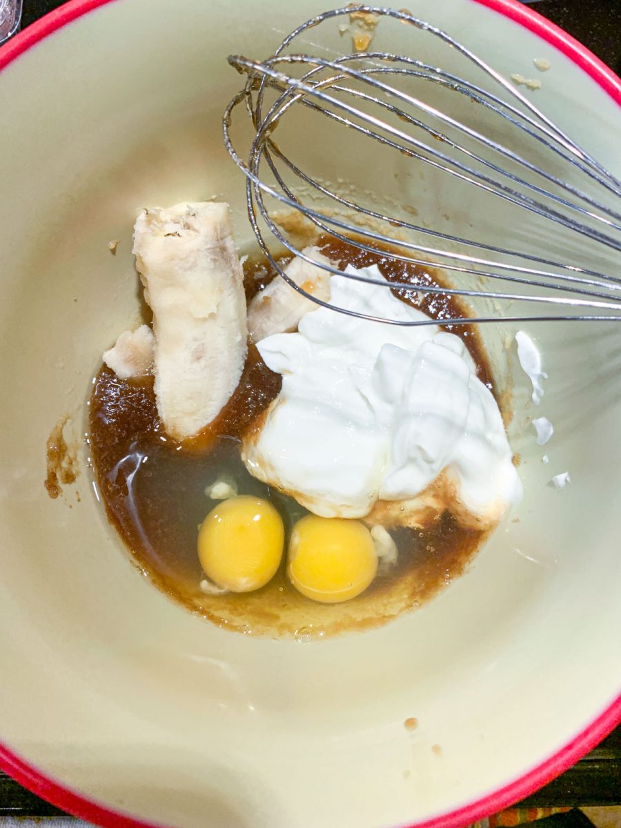 Mixing bowl with bananas, eggs, and greek yogurt.