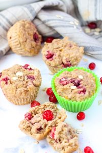 cranberry muffins on a white countertop
