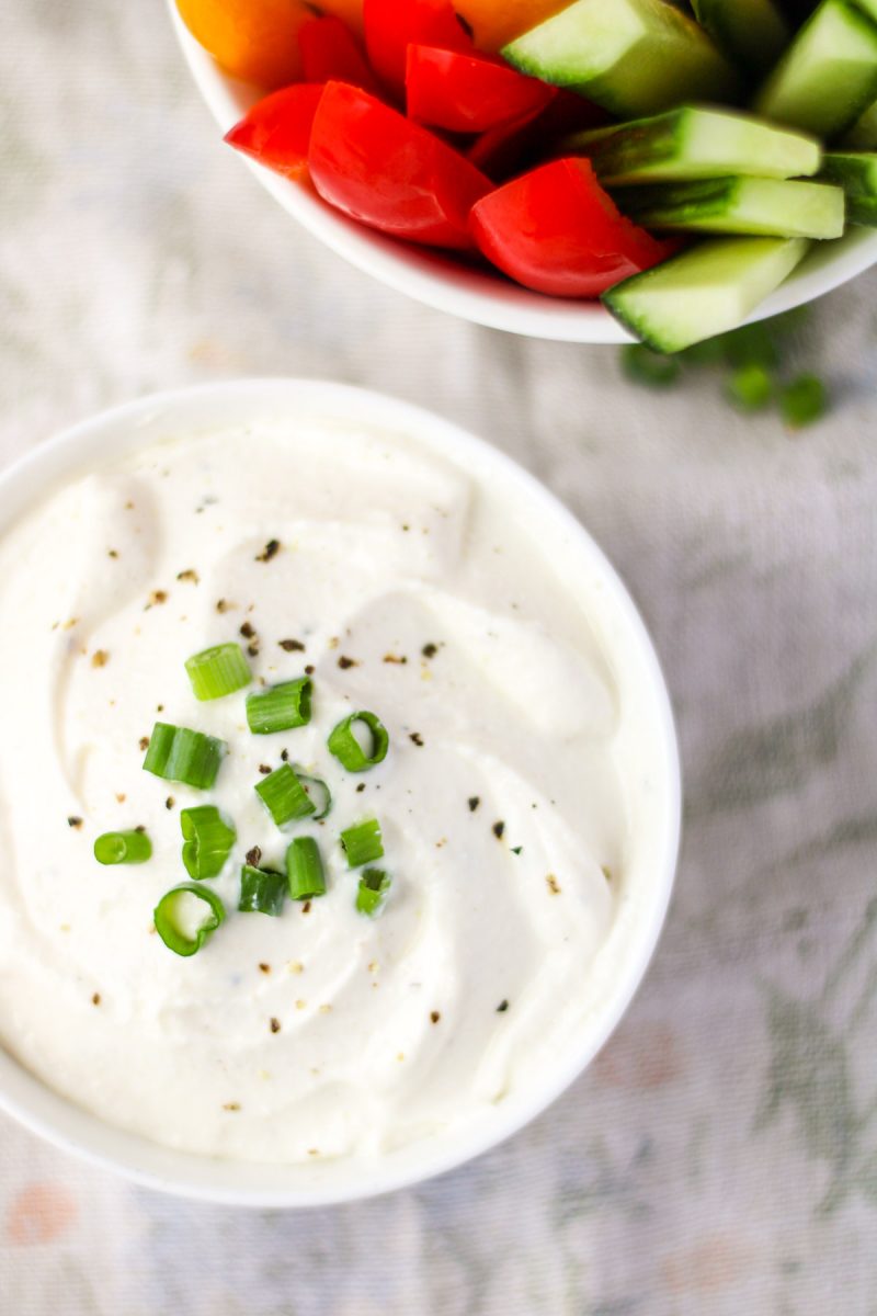 A small white bowl of high protein vegetable dip.