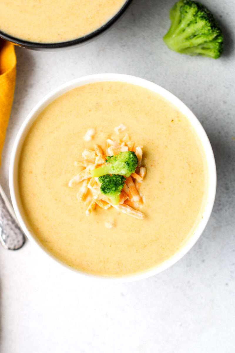 Instant Pot Broccoli Cheese Soup in a white bowl.
