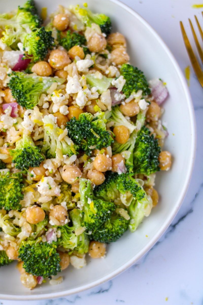 A large white dish filled with Brown Rice, Broccoli and Feta Salad