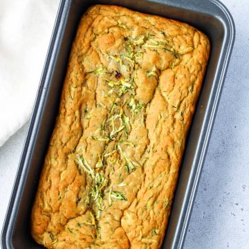 Loaf of Gluten-Free Zucchini Bread in a loaf pan.