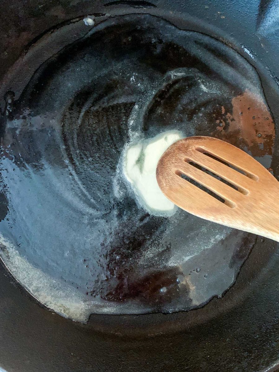 Melt butter in cast iron pan.