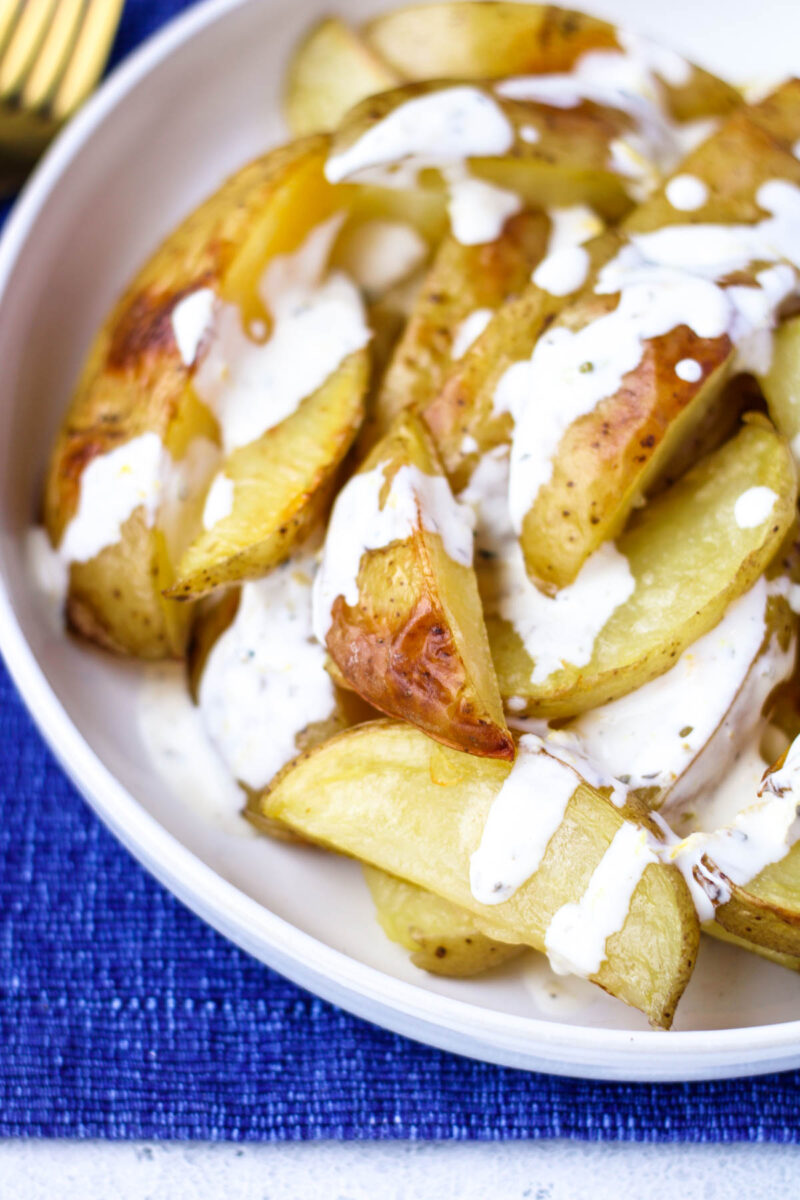 Roasted Yellow Potatoes on a white plate.
