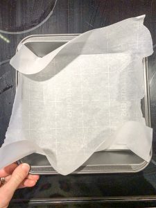 Parchment paper lined square baking pan