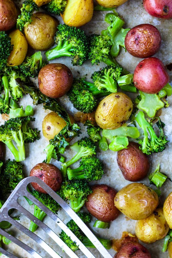 Roasted Broccoli and Potatoes on a cookie sheet.