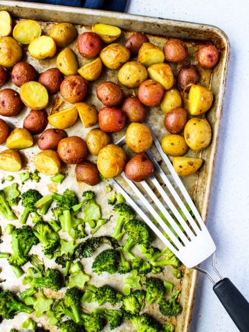 Roasted Broccoli and Potatoes on a large sheet pan.