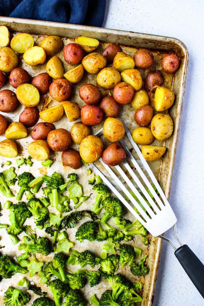 Roasted Broccoli and Potatoes on a large sheet pan.