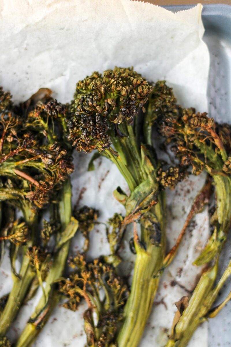Small pan of roasted broccolini.