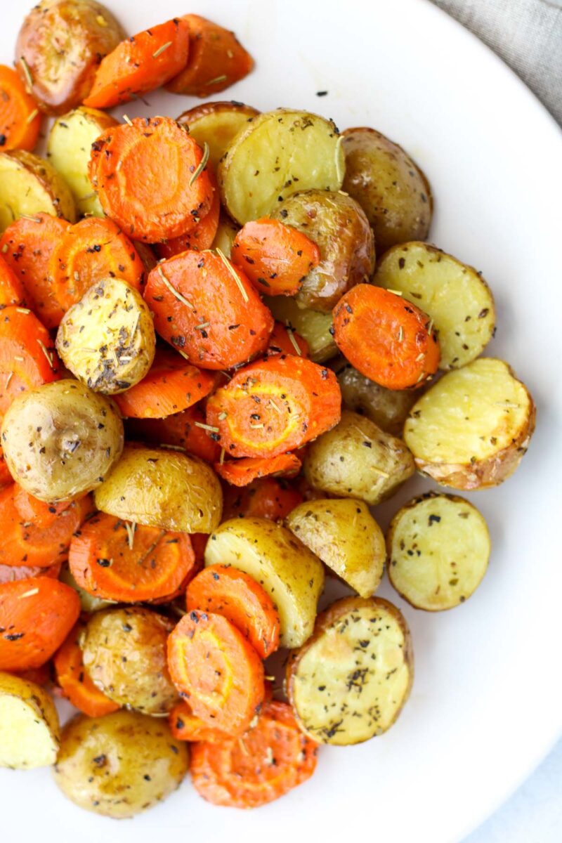 Roasted Potatoes and Carrots on a white plate.