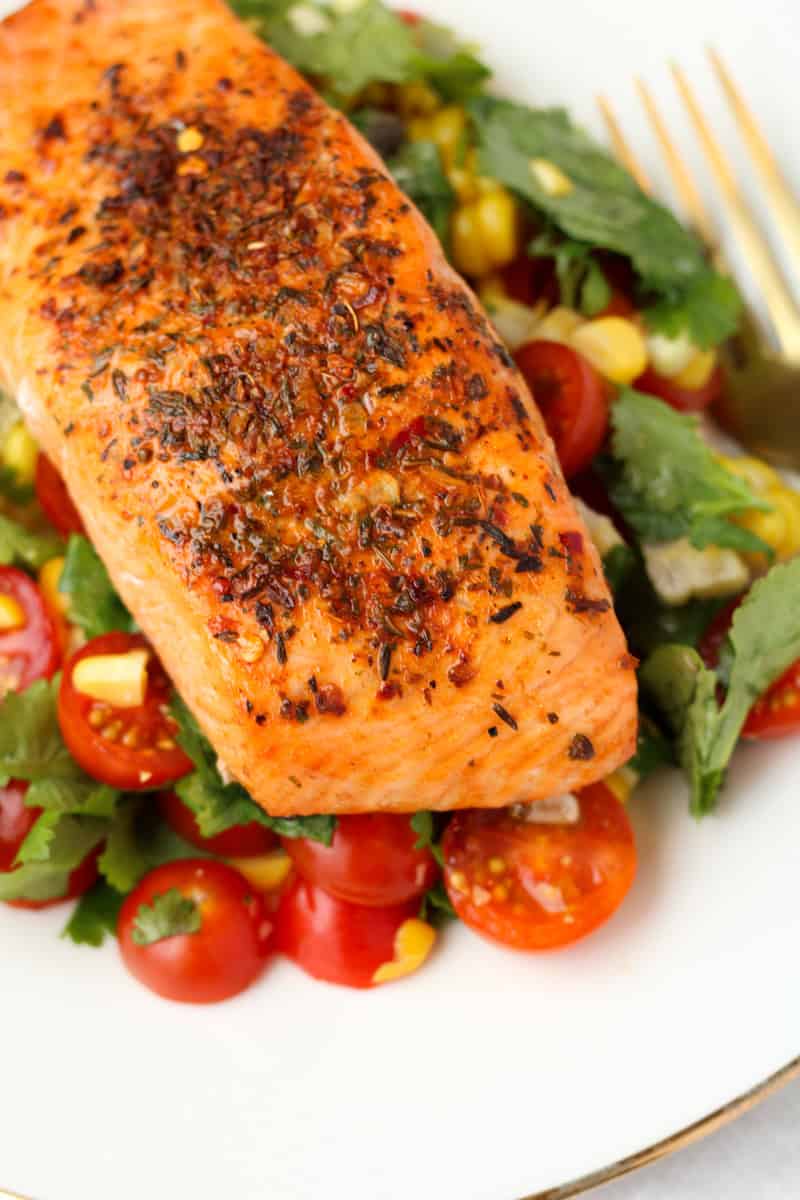 Cajun Salmon with Simple Corn Salsa on a white plate.
