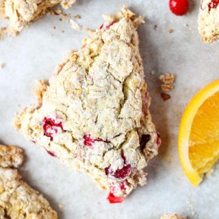 a cranberry oatmeal scone on a baking tray covered in parchment paper