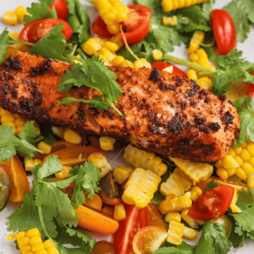 Easy Cajun Salmon with Simple Corn Salsa on a white plate.