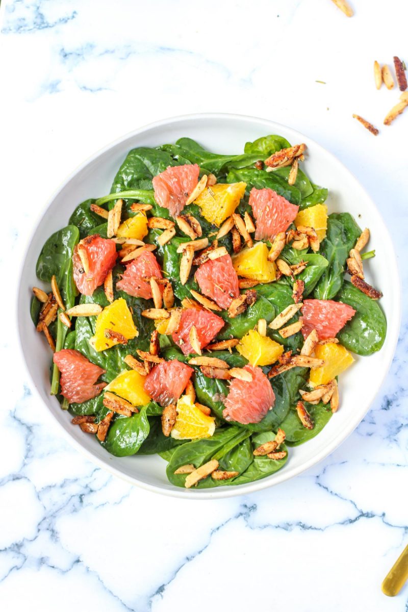 overheat shot of a spinach salad with oranges and grapefruit sections
