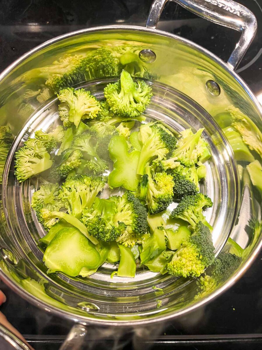 Steaming fresh broccoli in a steamer.