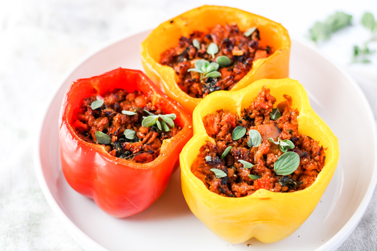 Three bell peppers on a white plate