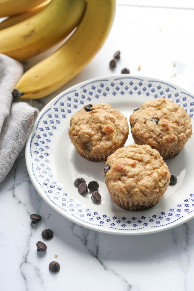 Three banana muffins on a white plate.